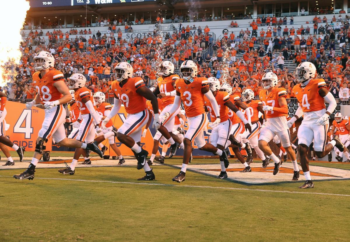 The Virginia Cavaliers take the field at Scott Stadium for the football season opener.